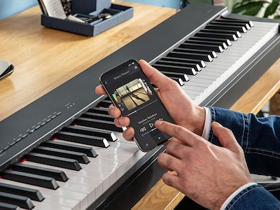 A person operating a smart phone to play music