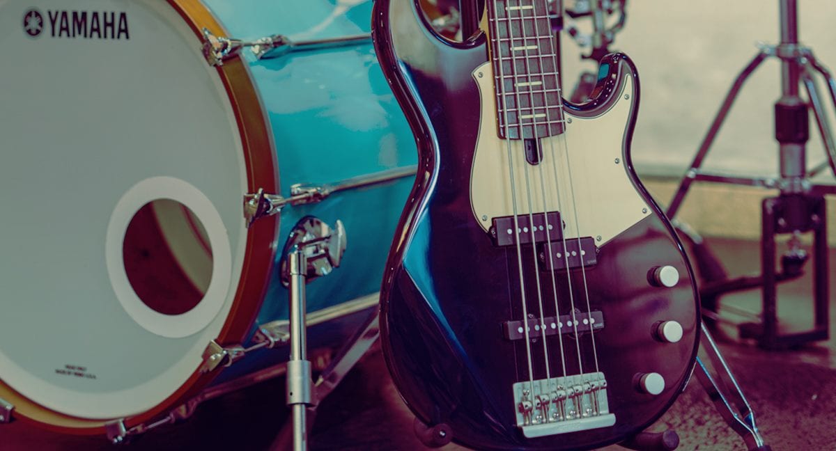 Close-up of BBP35 Midnight Blue body next to a Yamaha drumkit